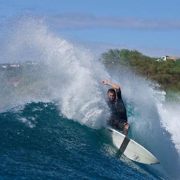 Jason Clark surfing the Maui waves