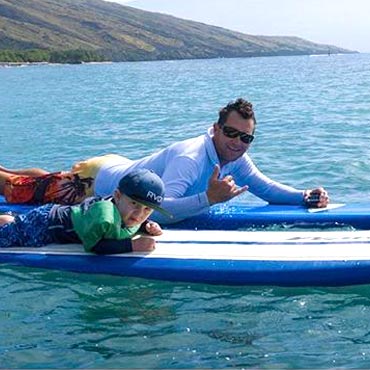 Jason and child on surf boards